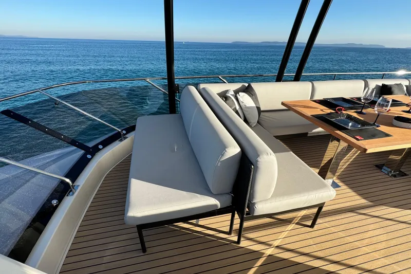  Yacht Photos Pics Luxurious 2024 Prestige M48 yacht deck with elegant seating and ocean view.