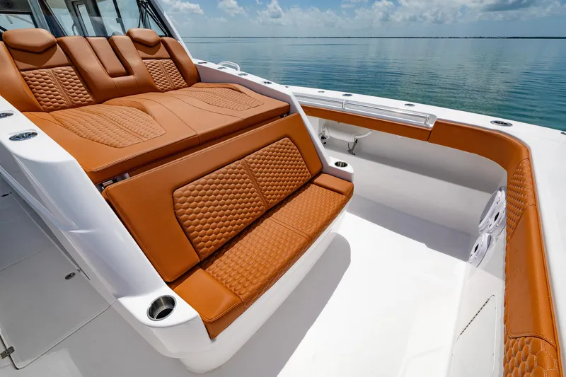  Yacht Photos Pics Luxurious seating on 2023 Invincible 46 Pilothouse boat with ocean view.