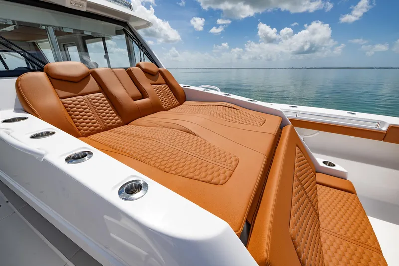  Yacht Photos Pics Luxurious seating on 2023 Invincible 46 Pilothouse boat with ocean view.