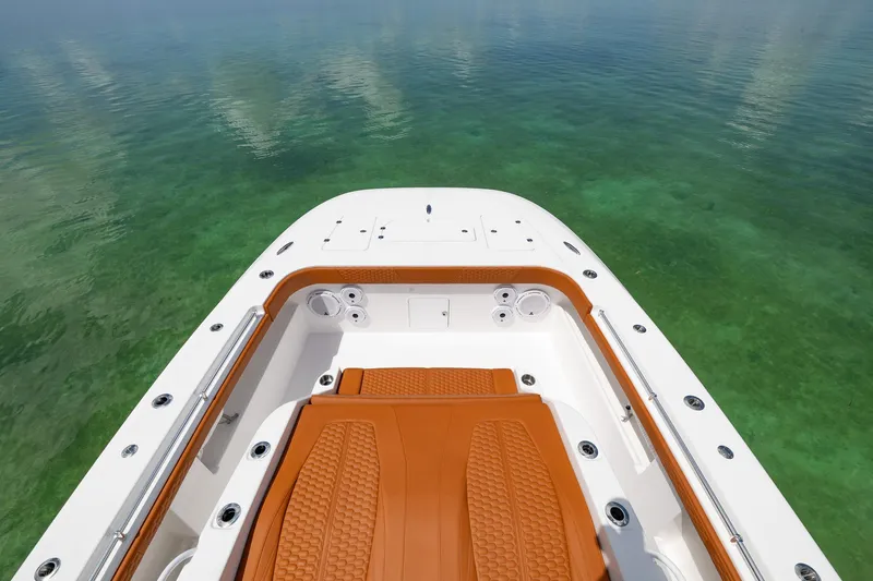  Yacht Photos Pics 2023 Invincible 46 Pilothouse boat deck on clear water.