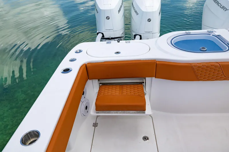  Yacht Photos Pics 2023 Invincible 46 Pilothouse boat with orange seating and dual Mercury engines.