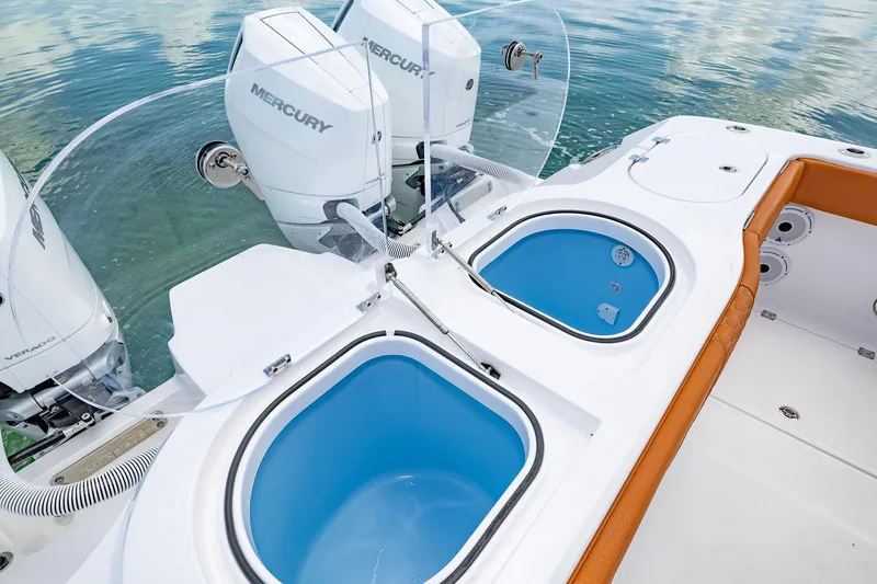  Yacht Photos Pics 2023 Invincible 46 Pilothouse with dual Mercury outboard engines and livewell tanks.