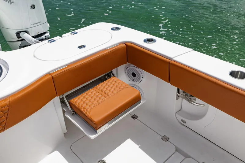  Yacht Photos Pics 2023 Invincible 46 Pilothouse boat interior with cushioned seating and storage.