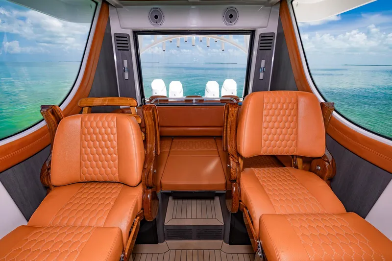  Yacht Photos Pics Luxurious interior of 2023 Invincible 46 Pilothouse with leather seating and ocean view.