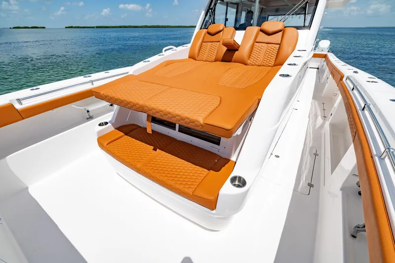  Yacht Photos Pics 2023 Invincible 46 Pilothouse with luxurious orange seating on deck.
