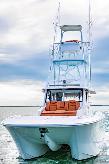  Yacht Photos Pics 2023 Invincible 46 Pilothouse yacht cruising on open water.