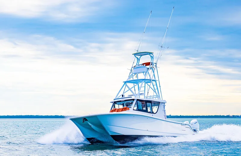  Yacht Photos Pics 2023 Invincible 46 Pilothouse boat cruising on open water.