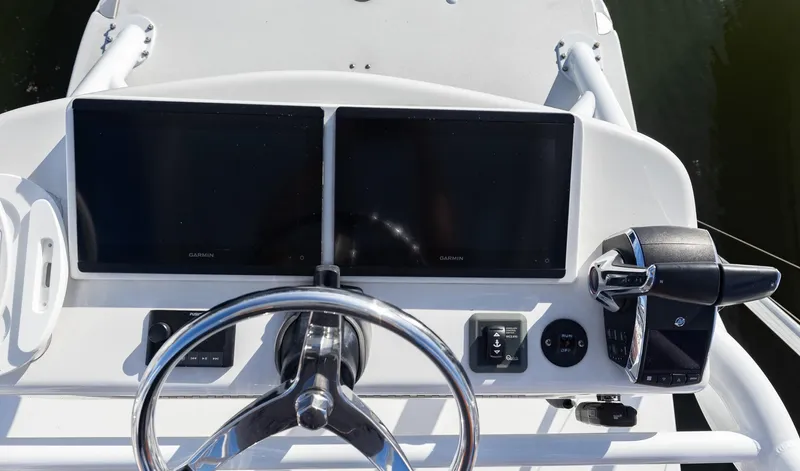  Yacht Photos Pics 2024 Invincible 46 Pilothouse helm with dual screens and steering wheel.