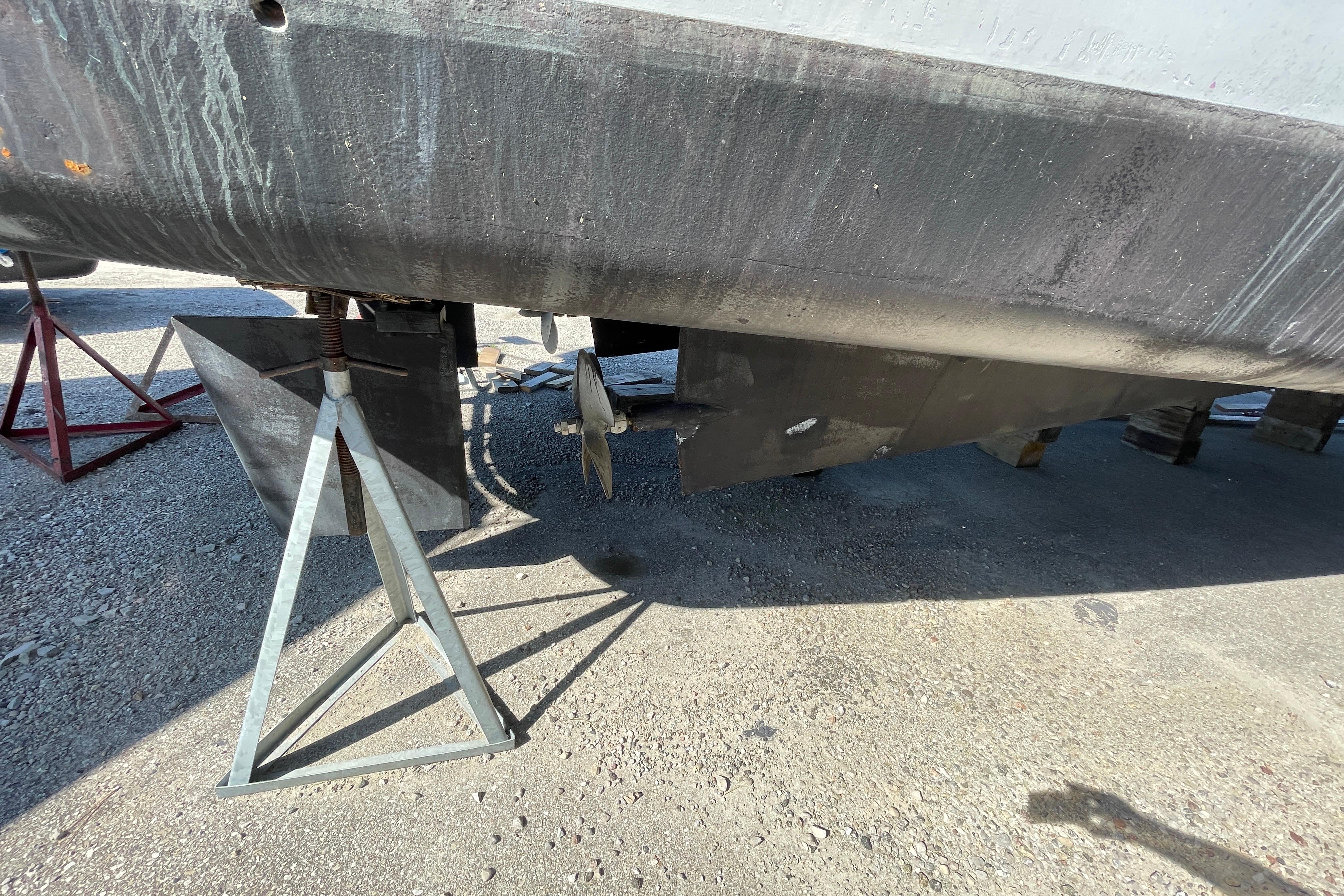1966 Vinette 430 Trawler hull on dry dock, showing propeller and support stands.