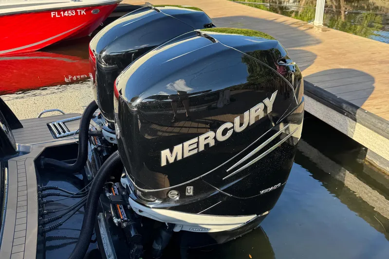 Yacht Photos Pics Twin Mercury outboard engines on a 2018 Scout 300 LXF boat at a dock.