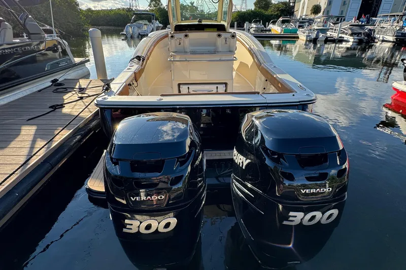  Yacht Photos Pics 2018 Scout 300 LXF boat with twin Mercury Verado 300 engines docked at marina.