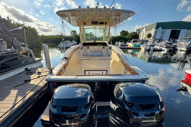  Yacht Photos Pics 2018 Scout 300 LXF boat with twin Mercury Verado engines docked at marina.