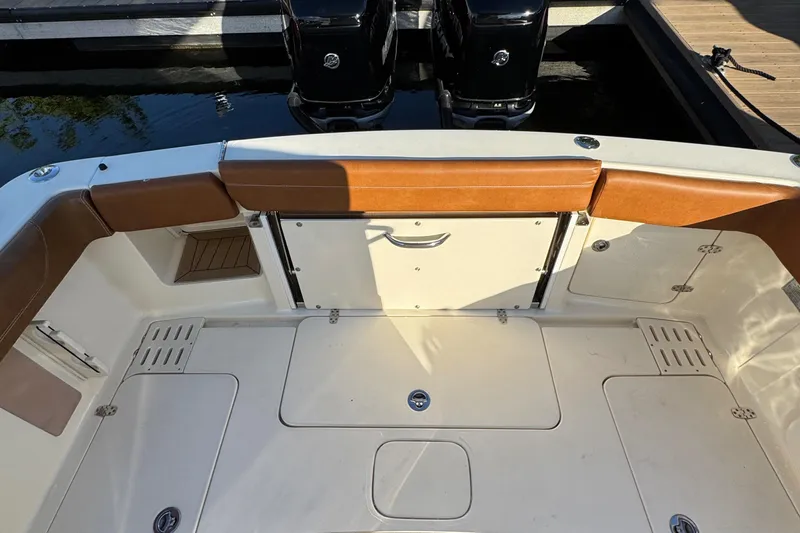  Yacht Photos Pics 2018 Scout 300 LXF boat deck with leather seating and twin engines.