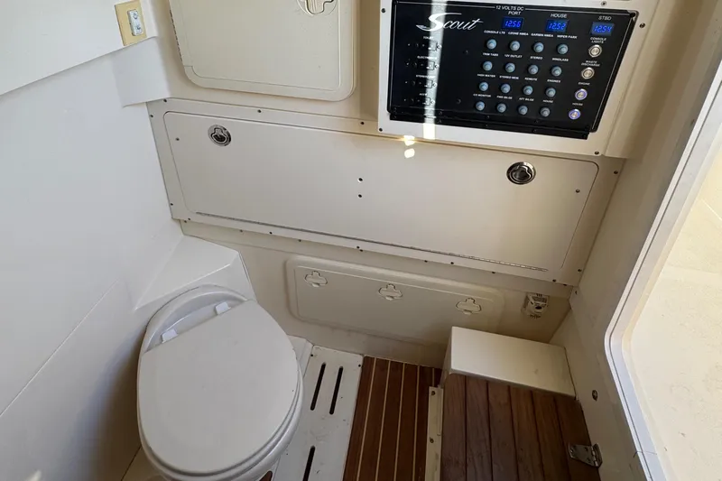  Yacht Photos Pics 2018 Scout 300 LXF boat interior with control panel and toilet.