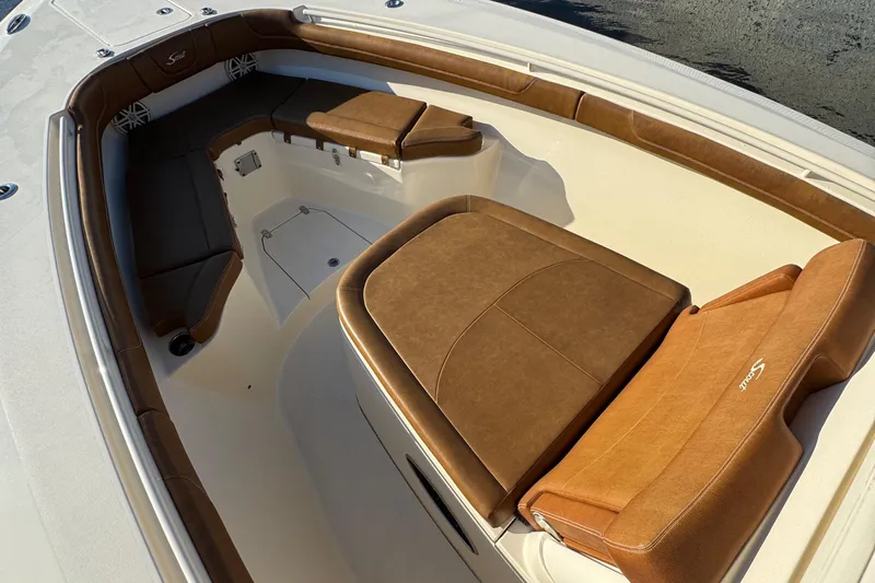  Yacht Photos Pics 2018 Scout 300 LXF boat interior with tan leather seating and spacious layout.