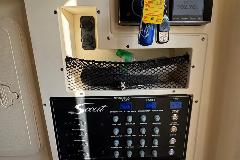  Yacht Photos Pics Control panel of 2018 Scout 300 LXF boat with switches and digital display.