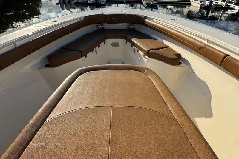  Yacht Photos Pics 2018 Scout 300 LXF boat interior with brown cushioned seating.