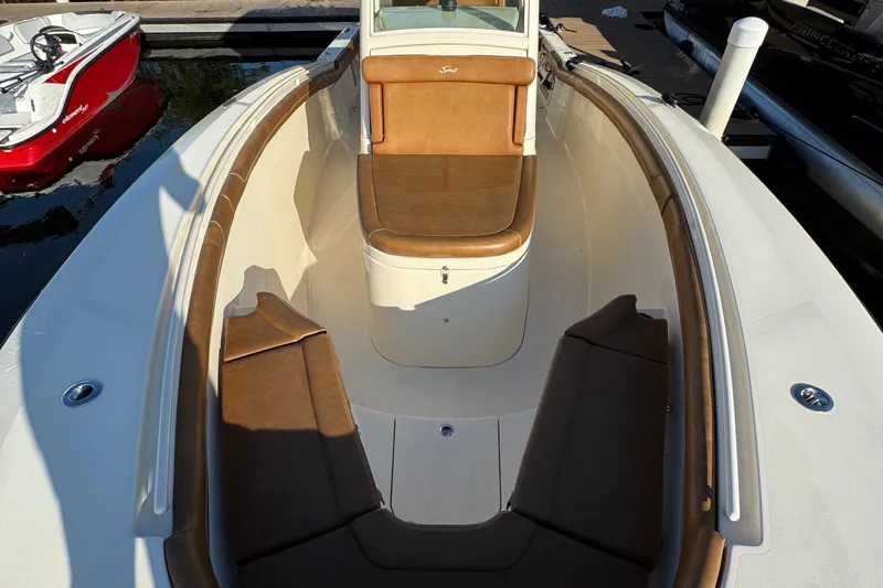  Yacht Photos Pics 2018 Scout 300 LXF boat interior with brown seating and white deck.