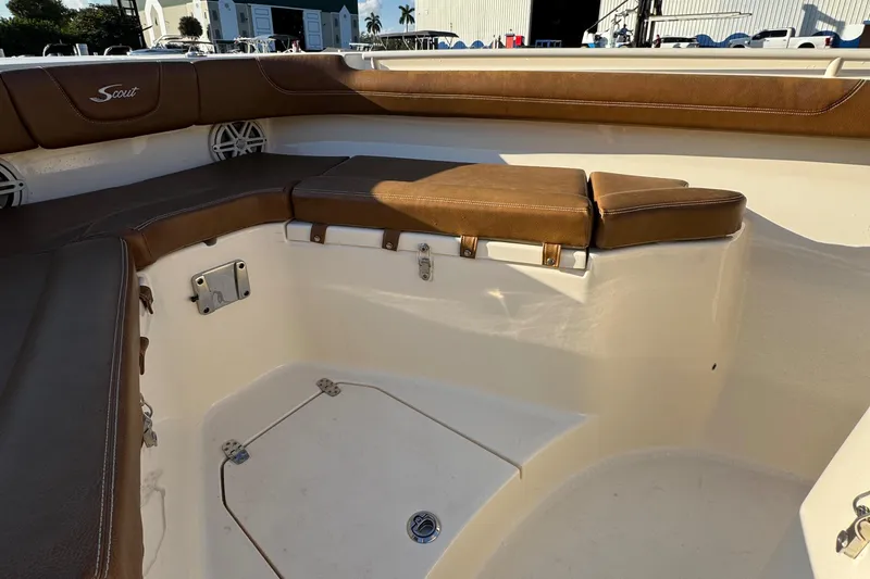  Yacht Photos Pics 2018 Scout 300 LXF boat interior with brown cushioned seating.