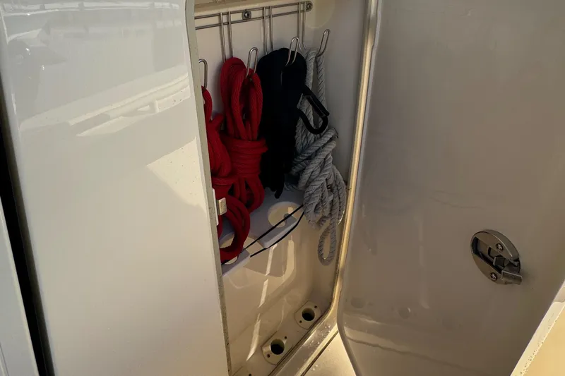  Yacht Photos Pics 2018 Scout 300 LXF boat storage compartment with ropes.