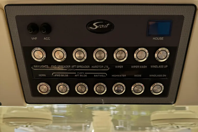  Yacht Photos Pics Control panel of 2018 Scout 300 LXF boat with various switches and buttons.