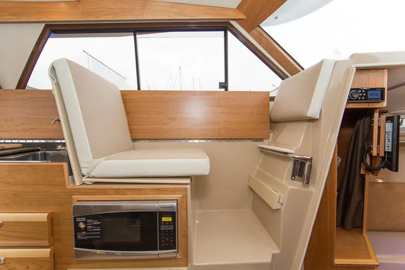 Ruff Life Yacht Photos Pics Manufacturer Provided Image: Interior of 2022 Cutwater C-30 Sedan with seating and microwave.