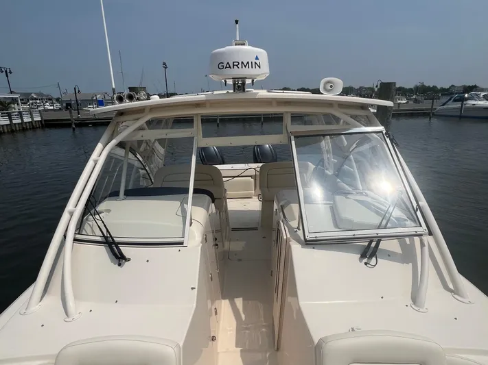  Yacht Photos Pics 2020 Grady-White Freedom 335 boat docked, featuring Garmin equipment.