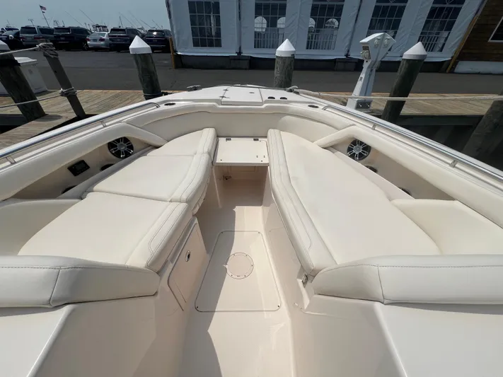  Yacht Photos Pics 2020 Grady-White Freedom 335 boat interior with spacious seating at dock.
