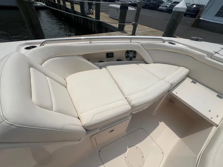  Yacht Photos Pics 2020 Grady-White Freedom 335 boat interior with white cushioned seating.