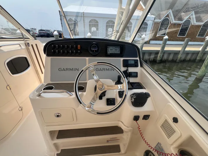  Yacht Photos Pics Helm of 2020 Grady-White Freedom 335 boat with Garmin navigation system.