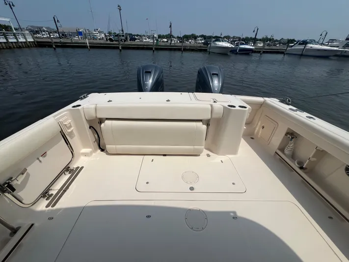  Yacht Photos Pics 2020 Grady-White Freedom 335 boat deck with dual engines at marina.
