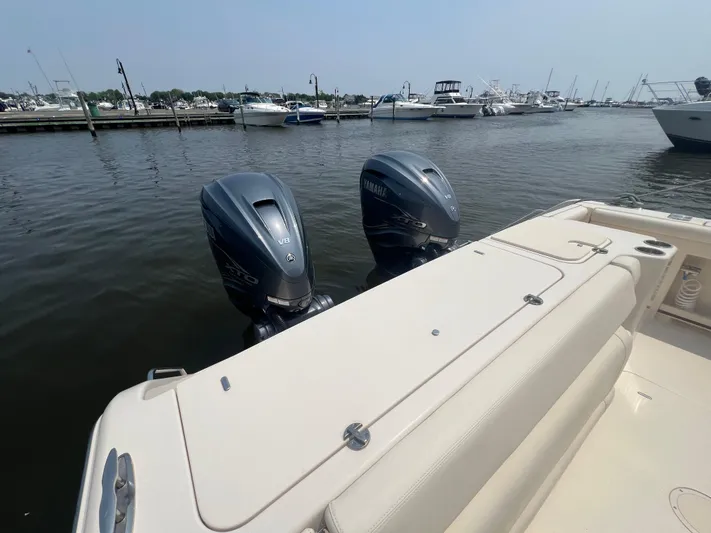 Yacht Photos Pics 2020 Grady-White Freedom 335 boat with twin Yamaha outboard engines at marina.