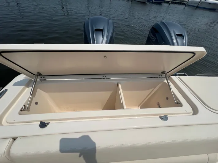  Yacht Photos Pics Open storage compartment on 2020 Grady-White Freedom 335 boat, with dual engines visible.