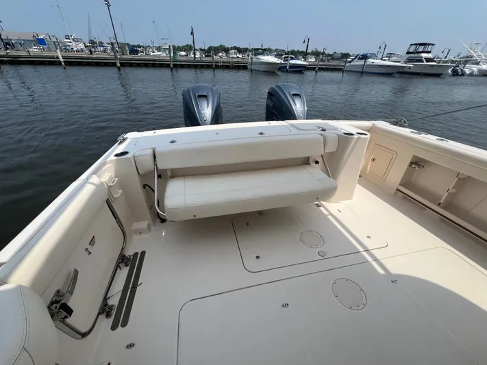  Yacht Photos Pics 2020 Grady-White Freedom 335 boat with dual engines, docked at a marina.