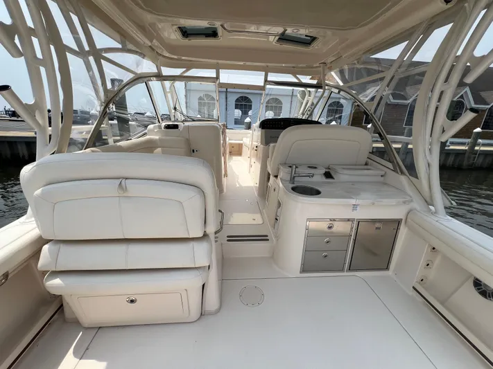  Yacht Photos Pics 2020 Grady-White Freedom 335 boat interior with luxurious seating and storage compartments.