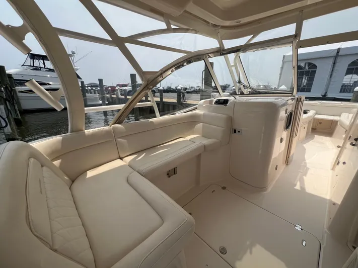  Yacht Photos Pics 2020 Grady-White Freedom 335 boat interior with beige seating and spacious layout.