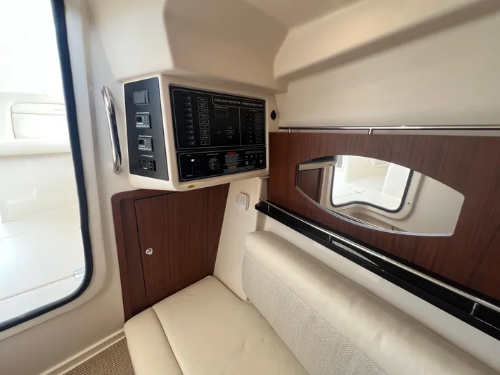  Yacht Photos Pics 2020 Grady-White Freedom 335 interior with control panel and seating area.