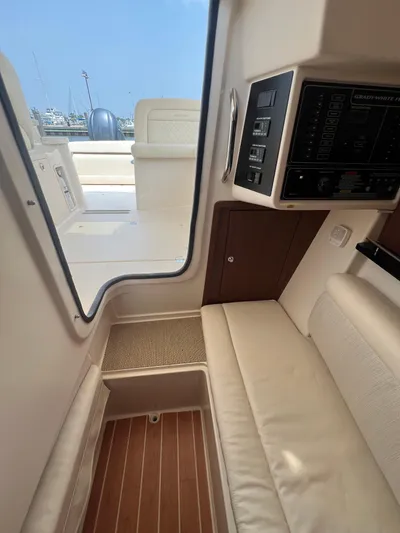  Yacht Photos Pics 2020 Grady-White Freedom 335 interior with seating and control panel.