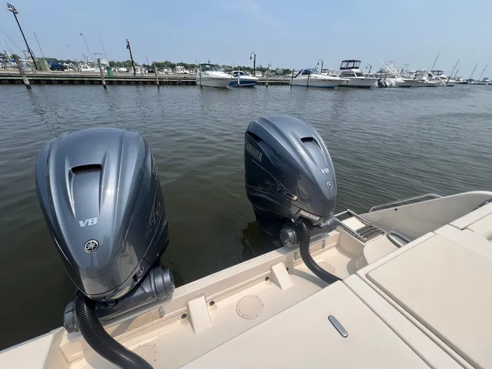  Yacht Photos Pics 2020 Grady-White Freedom 335 with twin Yamaha V8 engines at marina dock.