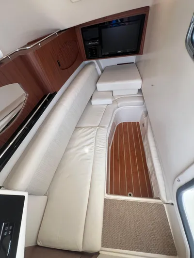  Yacht Photos Pics 2020 Grady-White Freedom 335 interior with white seating and wood accents.