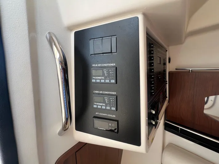  Yacht Photos Pics Control panel on 2020 Grady-White Freedom 335 boat, featuring switches and indicators.