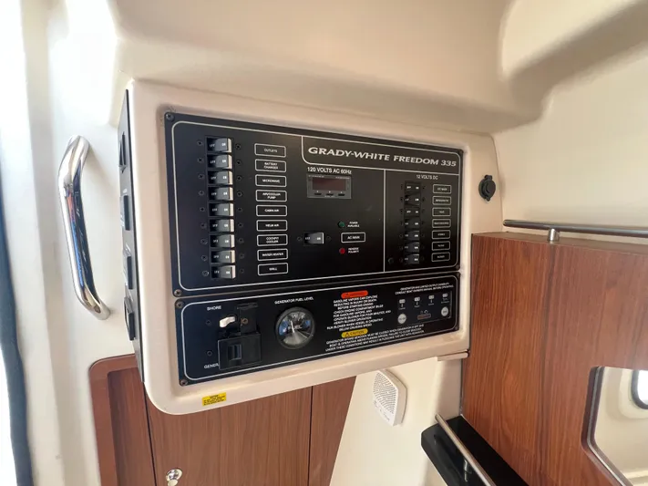  Yacht Photos Pics Control panel of 2020 Grady-White Freedom 335 boat, featuring switches and dials.