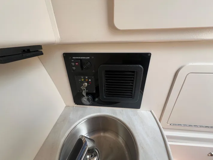  Yacht Photos Pics 2020 Grady-White Freedom 335 boat interior with control panel and sink.