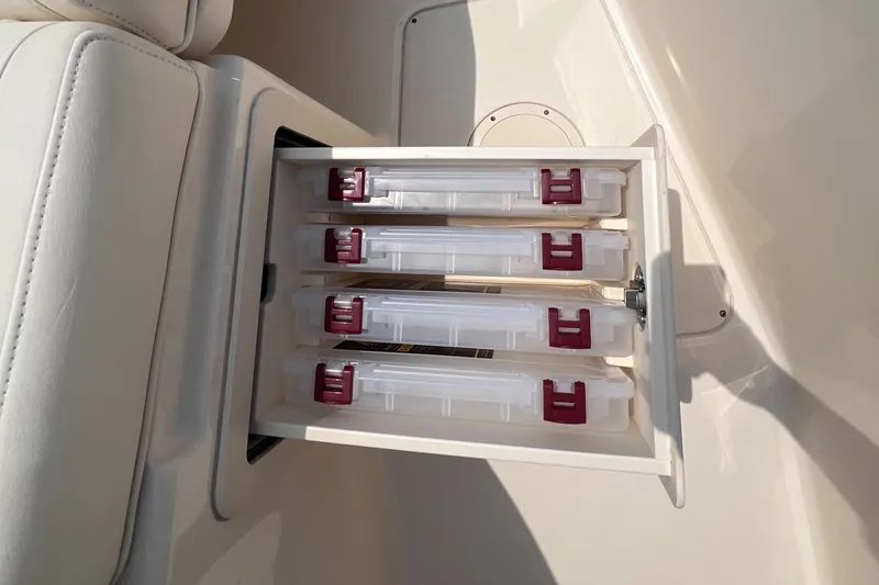  Yacht Photos Pics Storage compartment with tackle boxes on a 2020 Grady-White Freedom 335 boat.