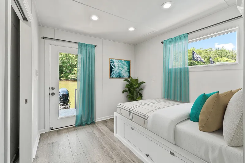  Yacht Photos Pics Modern bedroom interior on Hank's 40 Houseboat, 2025 model, with teal accents and natural light.