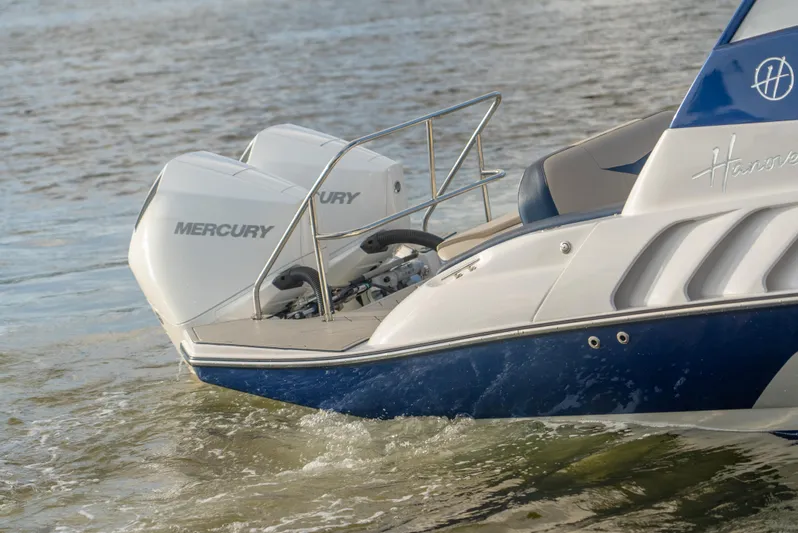  Yacht Photos Pics 2024 Hanover 305 boat with dual Mercury engines on water.