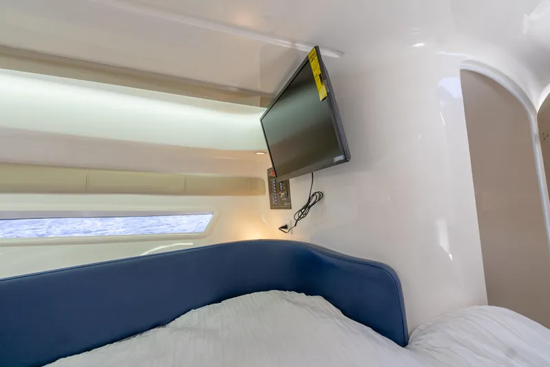  Yacht Photos Pics Interior of 2024 Hanover 305 boat cabin with TV and bed.