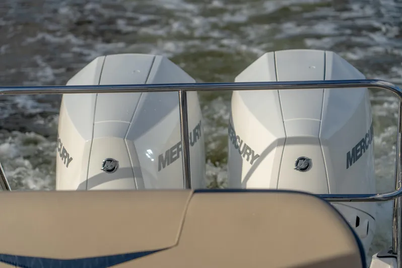  Yacht Photos Pics Twin Mercury outboard engines on a 2024 Hanover 305 boat, cruising through water.
