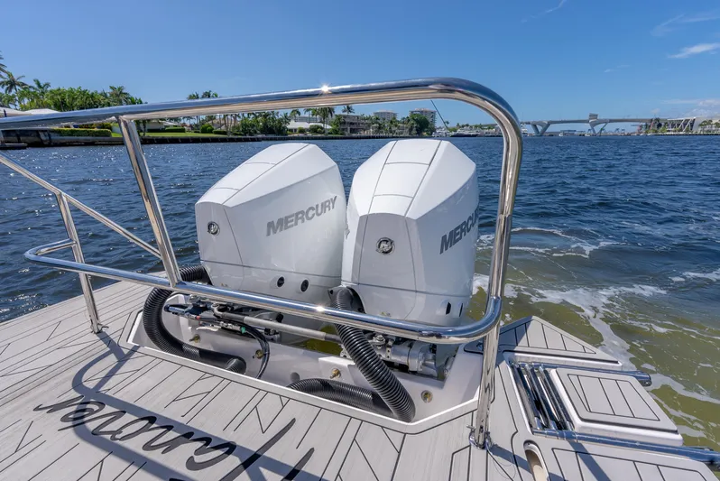  Yacht Photos Pics 2024 Hanover 305 boat with dual Mercury engines on a sunny day.