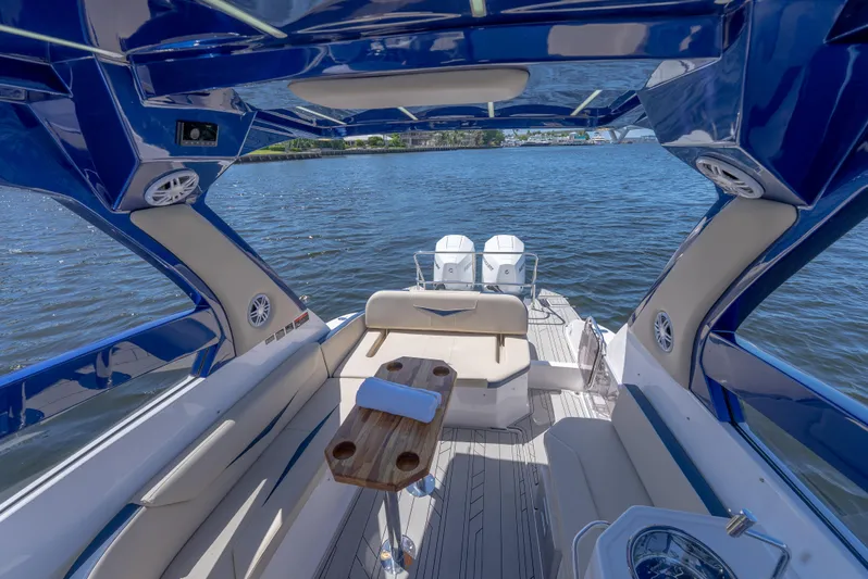  Yacht Photos Pics Luxurious 2024 Hanover 305 boat interior with elegant seating and scenic water view.